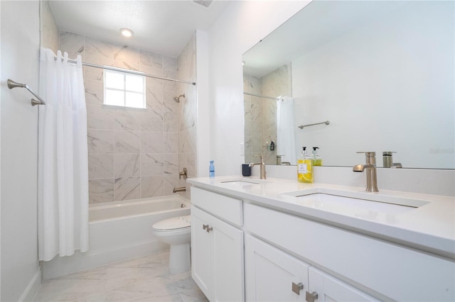 full bathroom featuring vanity, toilet, shower / bath combo with shower curtain, and tile patterned flooring