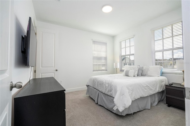 bedroom featuring light colored carpet