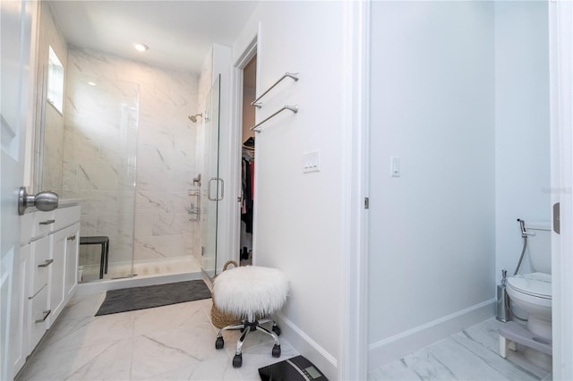 bathroom featuring toilet, tile patterned flooring, an enclosed shower, and vanity