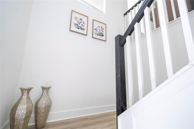 stairs with wood-type flooring