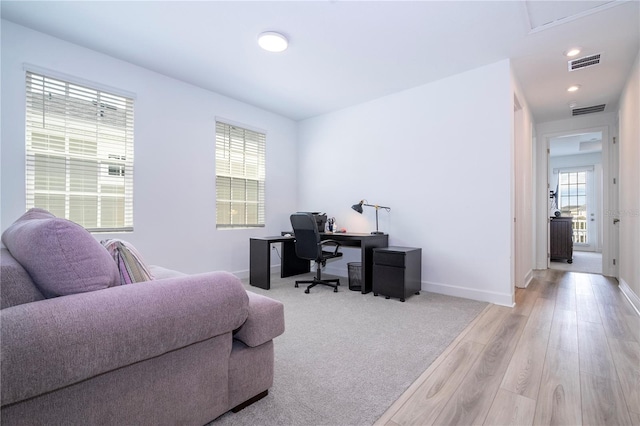 home office with light wood-type flooring