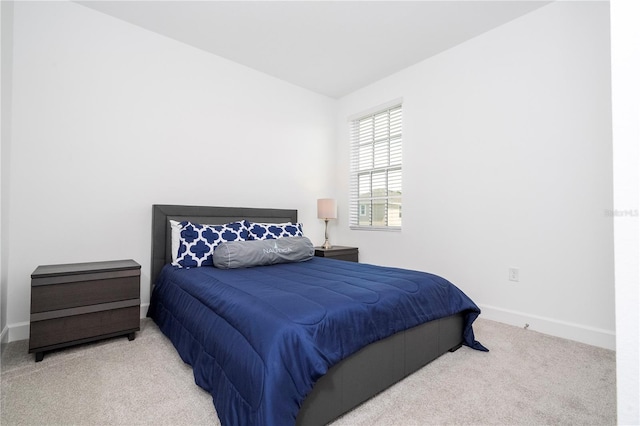 bedroom with light colored carpet