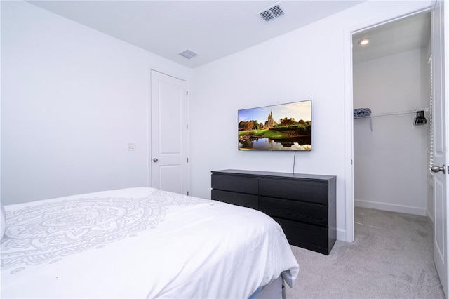 carpeted bedroom featuring a closet