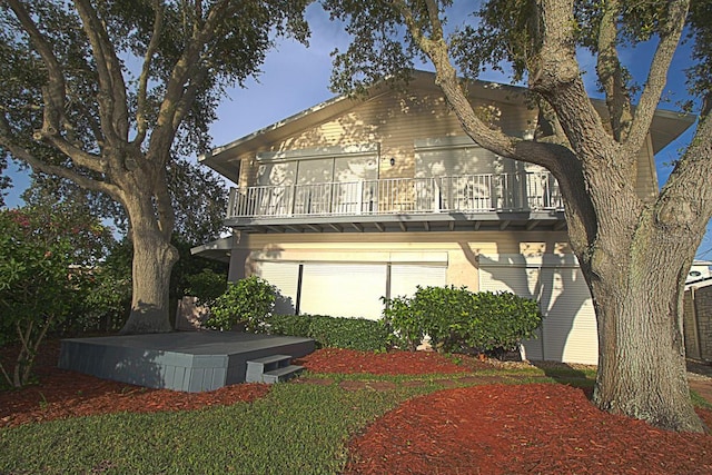 rear view of property featuring a garage