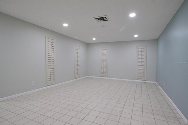 unfurnished room featuring light tile patterned floors