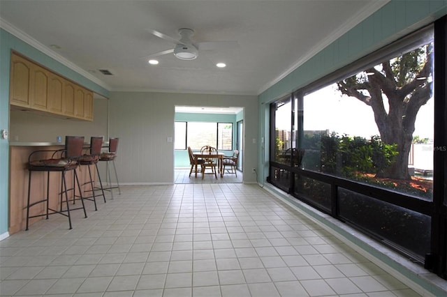 sunroom with ceiling fan