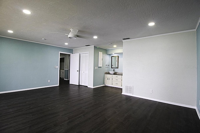 unfurnished living room with a textured ceiling, crown molding, ceiling fan, and dark hardwood / wood-style flooring