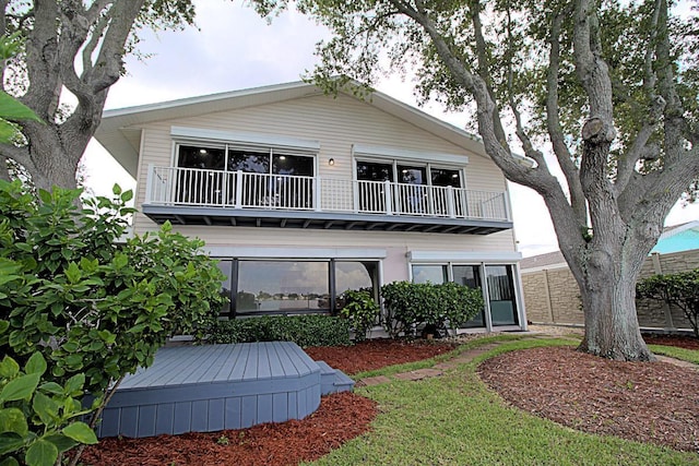 view of front of property with a balcony