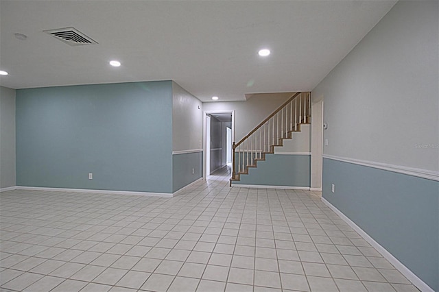 basement featuring light tile patterned flooring