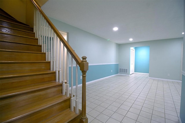 staircase with tile patterned flooring