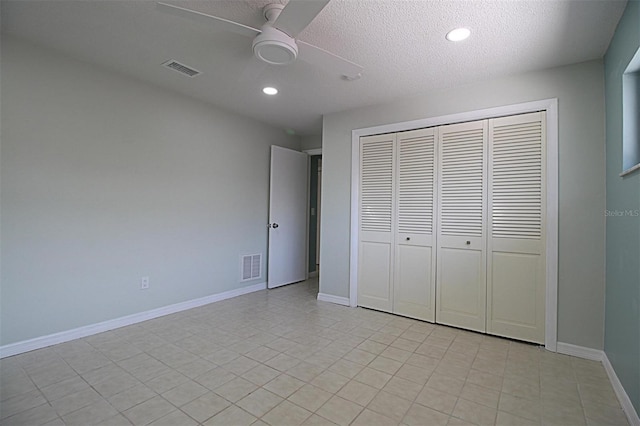 unfurnished bedroom with a closet, ceiling fan, and a textured ceiling