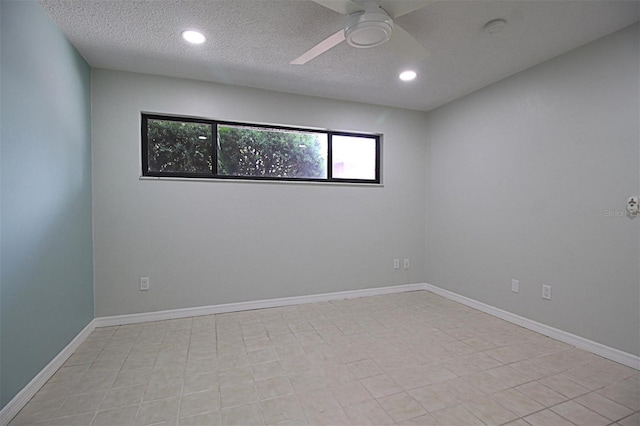 unfurnished room with a textured ceiling and ceiling fan