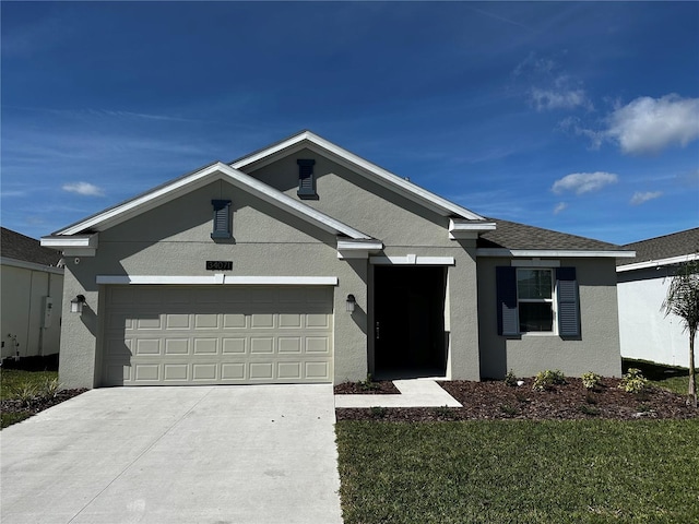 ranch-style house with a front lawn and a garage