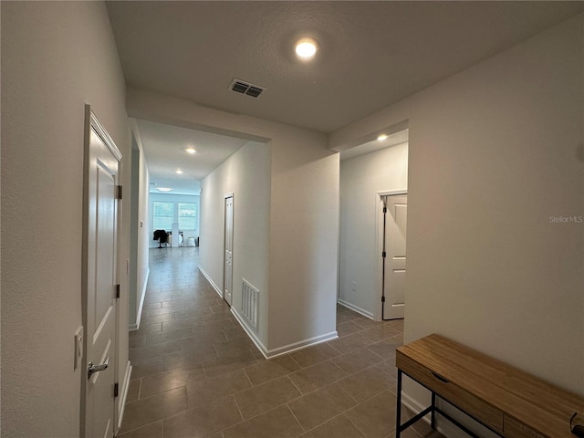 corridor with tile patterned flooring