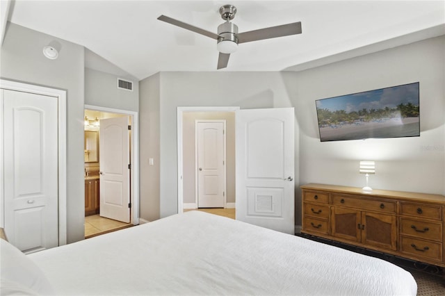 bedroom featuring ensuite bath and ceiling fan