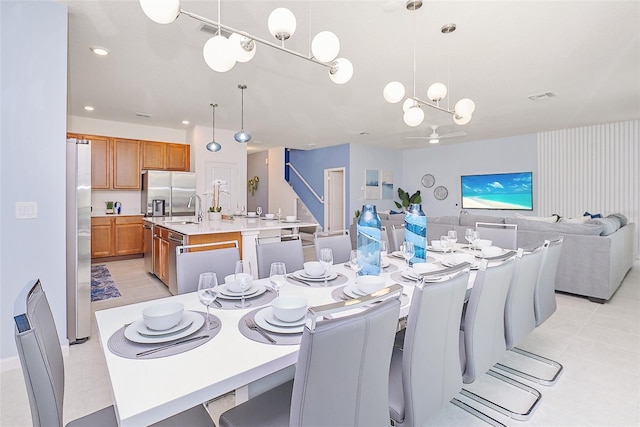 dining space with an inviting chandelier, light tile patterned floors, visible vents, and recessed lighting