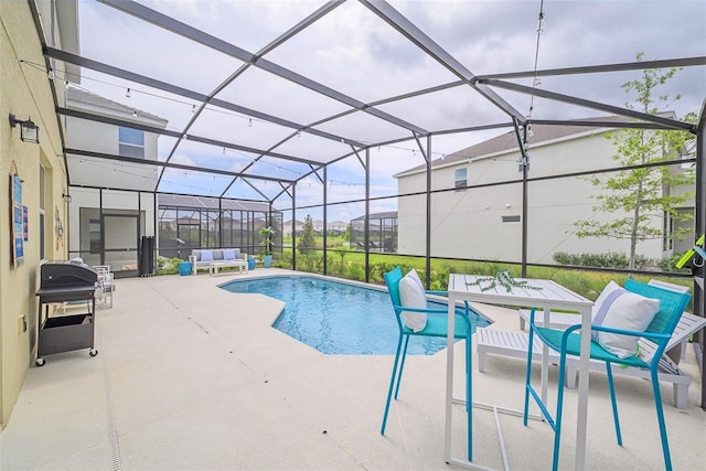 pool with a lanai, a patio area, and area for grilling