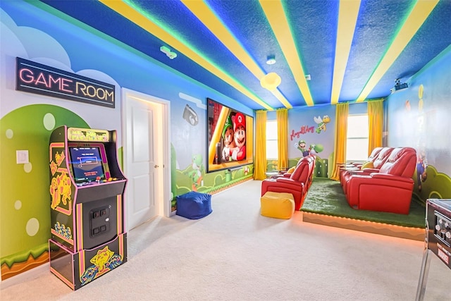 cinema room featuring a textured ceiling and carpet floors