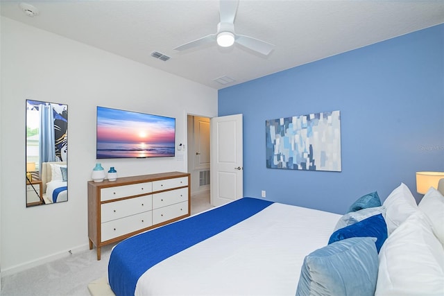 bedroom with ceiling fan, carpet flooring, visible vents, and baseboards