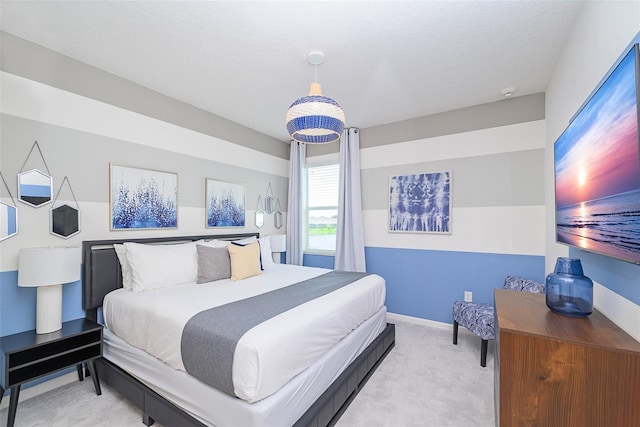 bedroom with baseboards and carpet flooring