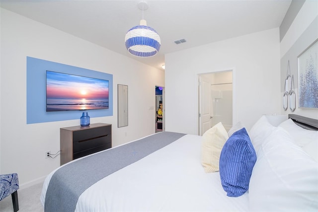 carpeted bedroom featuring visible vents and baseboards