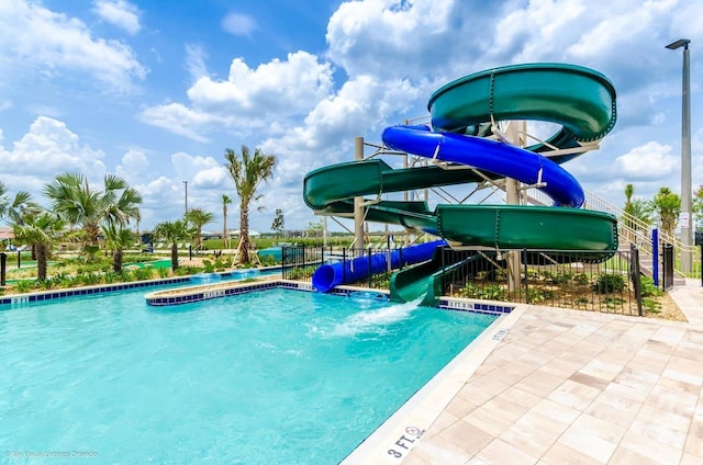 view of pool featuring a water slide