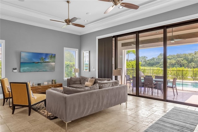 tiled living room with ornamental molding, ceiling fan, and a wealth of natural light