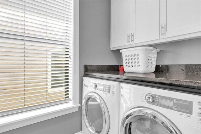 laundry area with washing machine and dryer