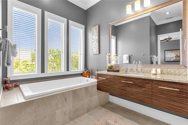 bathroom with vanity, a relaxing tiled tub, ornamental molding, and tile patterned flooring