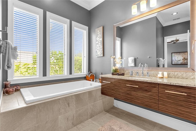 bathroom featuring crown molding, vanity, tiled bath, and tile patterned flooring