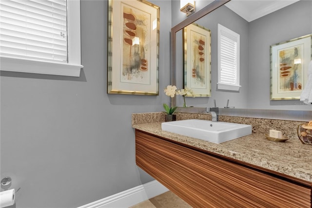 bathroom featuring vanity and crown molding