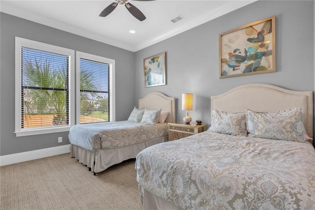 bedroom with ceiling fan, ornamental molding, and light carpet