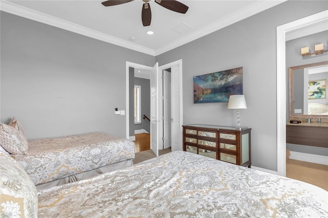 bedroom with ensuite bath, crown molding, and ceiling fan