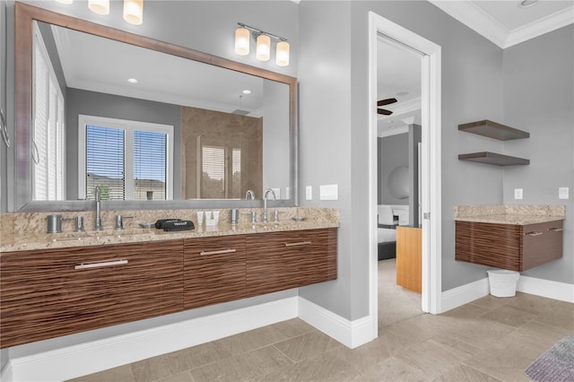 bathroom with ceiling fan, ornamental molding, a shower with door, and vanity