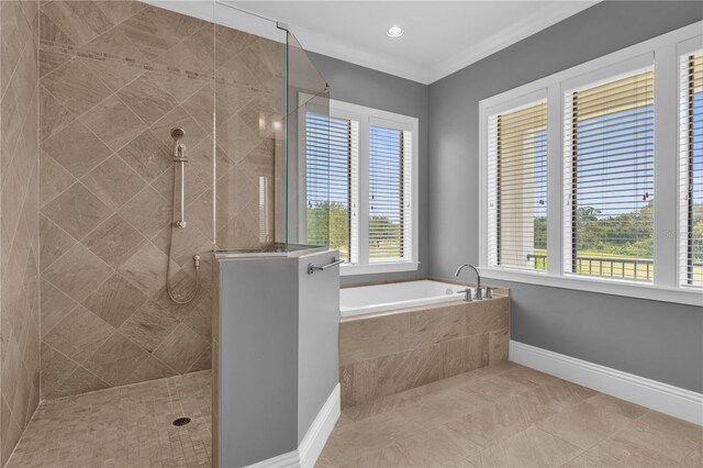 bathroom featuring plus walk in shower, tile patterned floors, and crown molding