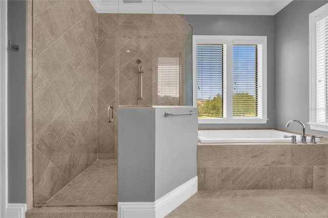 bathroom featuring tile patterned floors and separate shower and tub