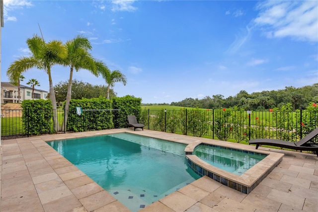 view of swimming pool with an in ground hot tub