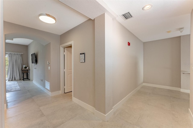 hallway with light tile patterned floors