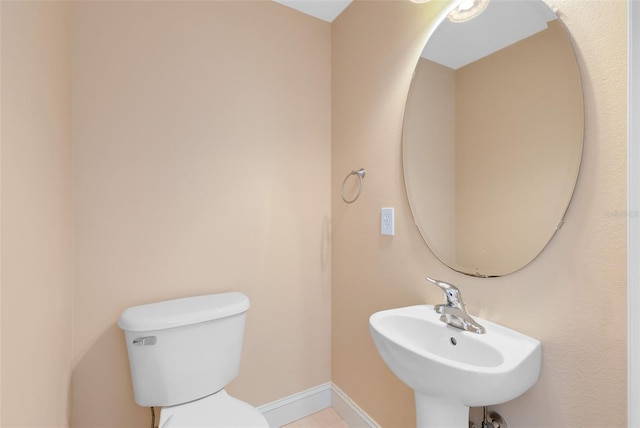 bathroom featuring sink and toilet