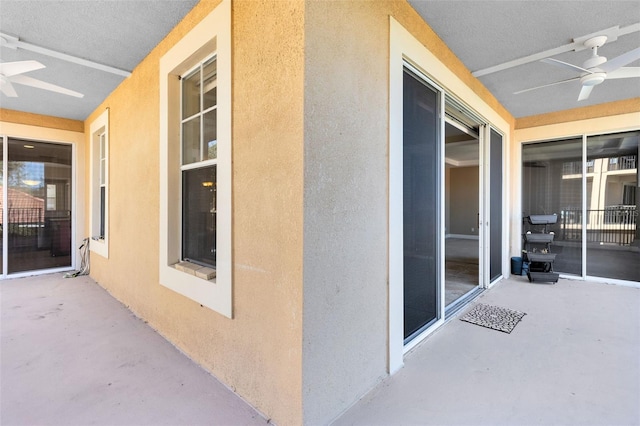 exterior space featuring ceiling fan and a patio area