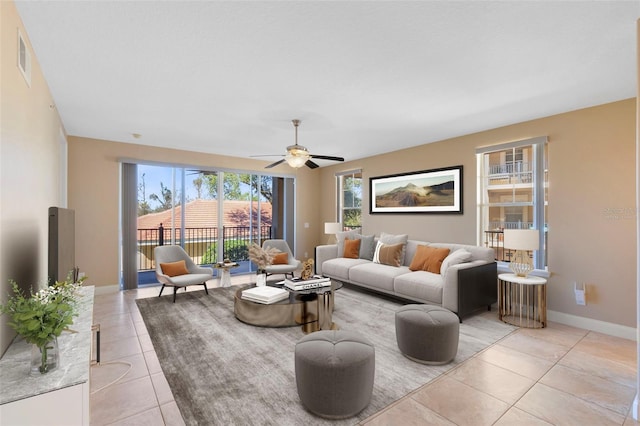 tiled living room with ceiling fan