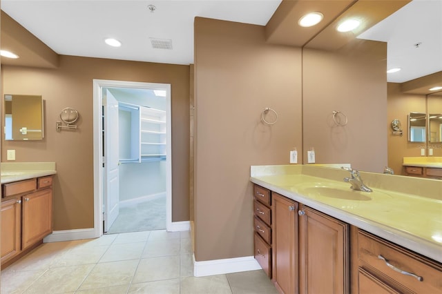 bathroom with tile patterned flooring and vanity