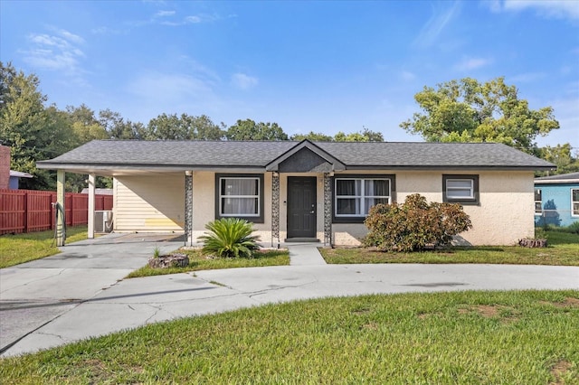 ranch-style home featuring a front yard