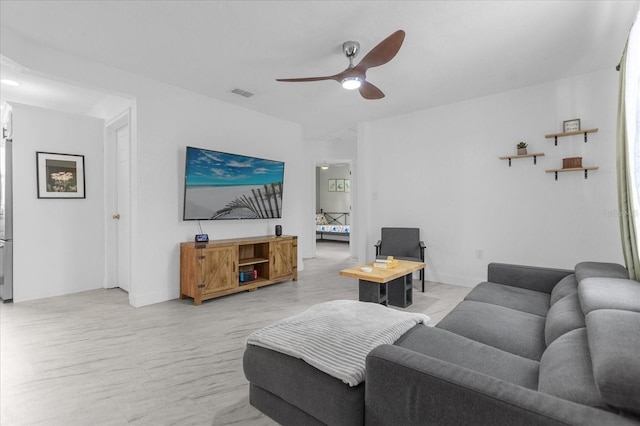 living room with ceiling fan