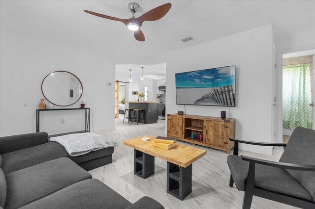 living room with ceiling fan