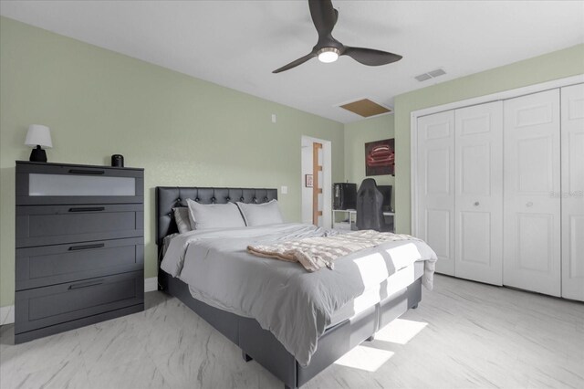 bedroom with ceiling fan and a closet