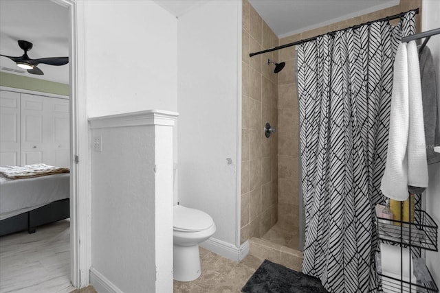 bathroom featuring toilet, tile patterned floors, ceiling fan, and a shower with curtain