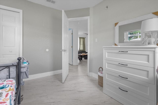 bedroom featuring light tile patterned floors