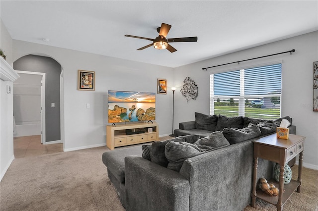 living room with ceiling fan and carpet flooring