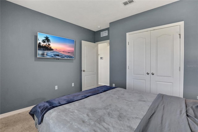 carpeted bedroom featuring a closet